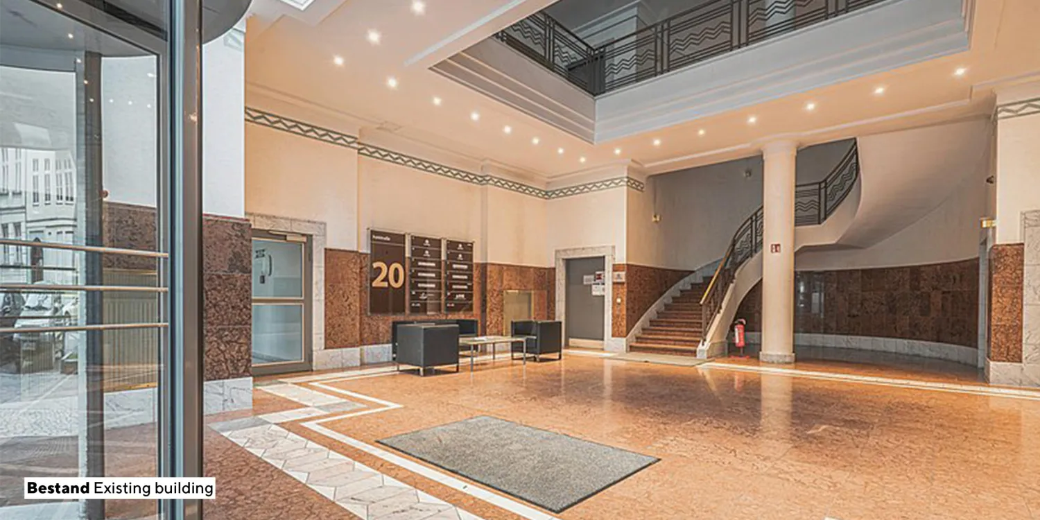 Elegantes Foyer der Pohlstraße Berlin mit Marmor und stilvoller Beleuchtung.