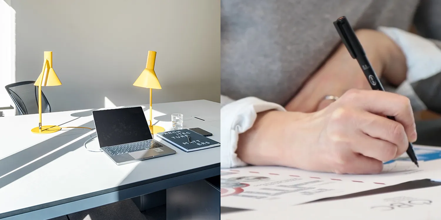 Büro mit Schreibtisch und Laptop. Hand mit Stift und Block