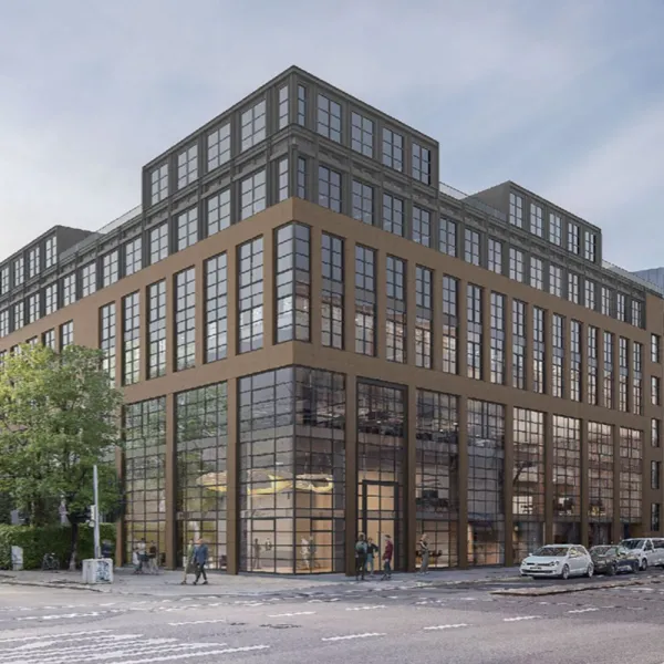 Modernes Gebäude mit brauner Fassade und viel Glasfläche. 