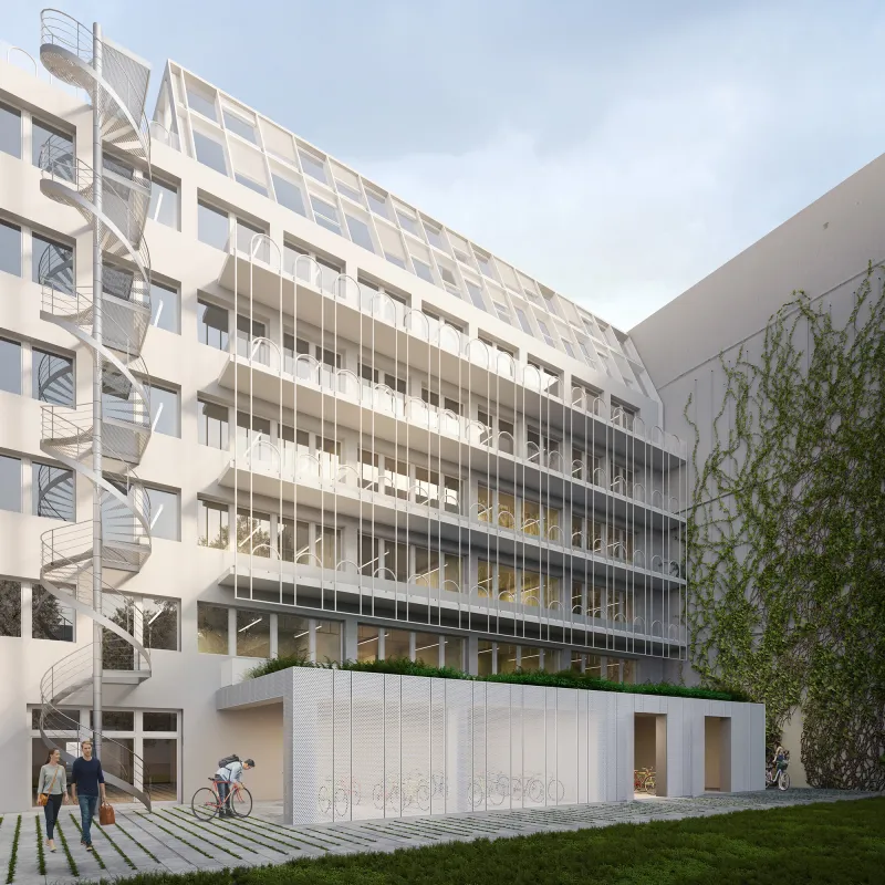 Rückseite der Alte Jakobstraße mit gestaffelter Fassade, Balkonen und begrüntem Außenbereich.