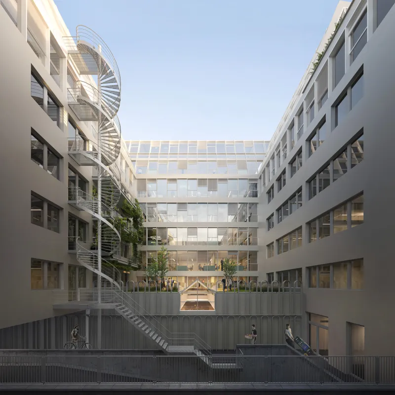 Offenes Atrium der Alte Jakobstraße mit Glasdach, begrünten Ebenen und verbindenden Stegen.